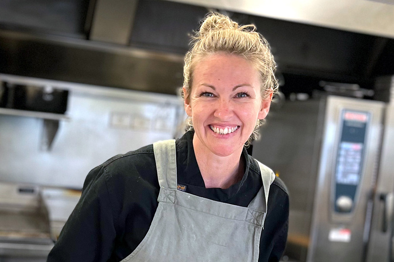 Kylee Slater, founder of Trophi, smiling in the kitchen