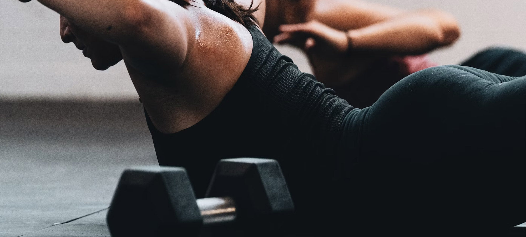 Active woman training with dumbbells
